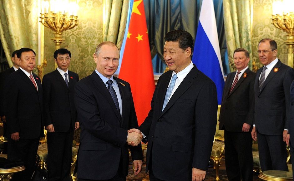 Vladimir Putin con el presidente chino Xi Jinping.